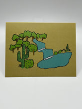 Load image into Gallery viewer, OASIS greeting card front, hand-drawn cacti, trees and a winding blue stream on a sand-colored background