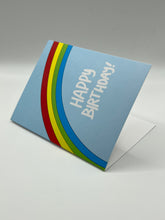 Load image into Gallery viewer, Rainbow Birthday greeting card standing at an angle, hand-drawn rainbow and Happy Birthday wording