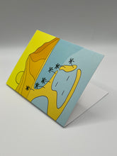 Load image into Gallery viewer, Island Magic greeting card standing at an angle, hand-drawn island lagoon and palms