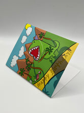 Load image into Gallery viewer, Dino Birthday greeting card standing at an angle, hand-drawn dinosaur and palm trees