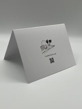 Load image into Gallery viewer, Back of a Paradise Visions greeting card with the logo